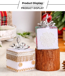 Detail of rustic Christmas gift box ornaments with lace ribbon and wooden button textures