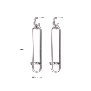 Detail view of 6cm long silver drop earrings with rhinestones and product dimensions