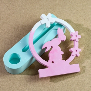 Macro detail of oval silicone mold and a rabbit silhouette scented candle plaster base