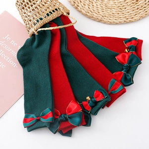 Christmas children's knee-high socks with big bows and bells in red and green knit cotton