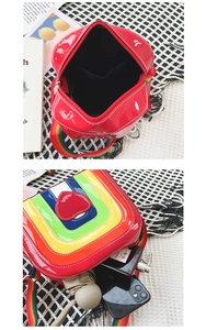 Rainbow crossbody bag showing internal capacity with phone and personal accessories