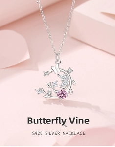 Detail of S925 silver necklace with pink floral butterfly pendant and zircon stones