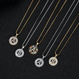 Gold and silver round initial necklaces with cubic zirconia baguette stones in assorted colors