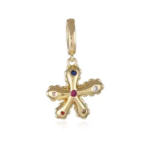 Detailed macro view of 18k gold plated star pendant with multi-colored cubic zirconia