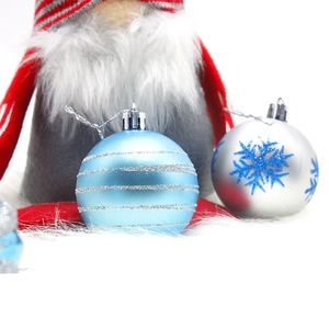 Blue and silver Christmas ball ornaments with glitter stripes and snowflake patterns