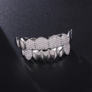 Silver hip hop grillz set with micro-pave cubic zirconia on a black textured background