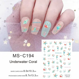 Macro detail of ocean coral nail stickers with seahorse and starfish patterns
