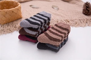 Close-up of striped coral fleece winter socks with soft plush texture in multiple colors