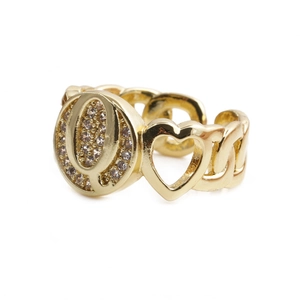 Detailed view of gold copper watch band ring with crystal letter Q and heart charm