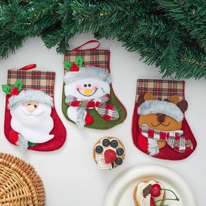 Christmas stocking ornaments featuring Santa Claus, Snowman, and Reindeer in plaid fabric