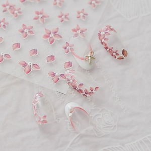 Delicate 5D cherry blossom nail stickers with 3D gold bow and pearl accents