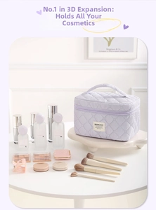 Detail of lavender quilted cosmetic bag with top handle and wrap-around zipper closure