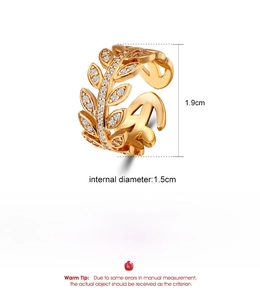 Detail showing dimensions of a gold leaf ring with cubic zirconia in copper