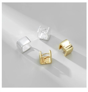 Detailed macro of S925 sterling silver square huggie earrings with a 925 hallmark