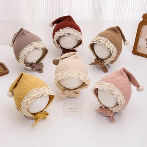 Knitted baby hats with lace trim and pom-pom in six assorted soft Morandi colors