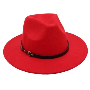 Detail of red wide brim wool fedora hat featuring black leather band and gold buckle