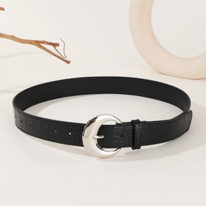 Y2K vintage black crocodile pattern leather belt with silver crescent buckle on a studio background
