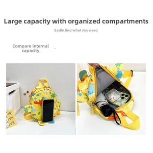 Detailed interior of yellow dinosaur kids backpack showing large capacity and compartments