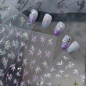 Close-up of Chinese bamboo leaf nail stickers with metallic purple and blue gradient effects