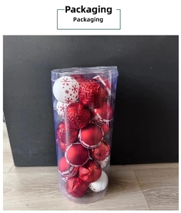 Detail of red and white Christmas ball ornaments with snowflake patterns in a clear tube