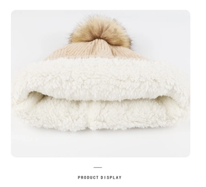 Detail showing plush white fleece lining and soft knit texture of the winter beanie