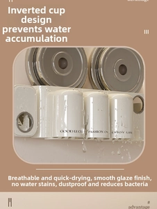 Detail of cream white wall-mounted toothbrush holder set with three upside-down drainage cups
