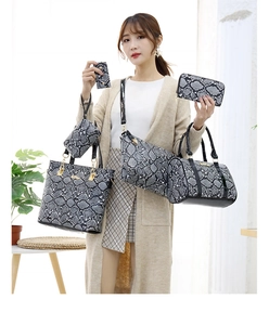 Detailed view of 6-piece handbag set with grey snakeskin texture and gold hardware