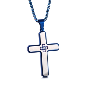 Close-up of blue and silver cross pendant with sparkling stones and matching box chain