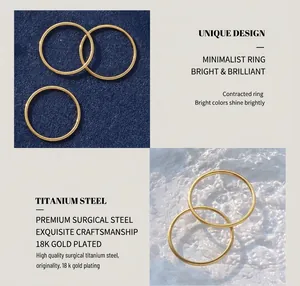 Macro shot of 18K gold plated titanium steel rings on premium velvet and ripple background