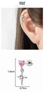 Detail showing heart-shaped zirconia earring with cross pendant measuring 1.56cm in height