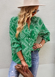 Detail of green paisley print on high-quality long sleeve blouse for professional office wear