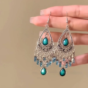 Bohemian silver drop earrings with turquoise stones and blue beaded tassels