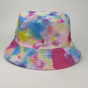 Detailed macro view of colorful tie-dye patterns and stitching on the brim of a bucket hat
