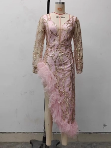 Detailed view of pink mesh evening gown with gold sequins and ruffled tulle skirt slit