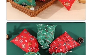 Detail of red and green Christmas linen drawstring gift bags with gold snowflake prints