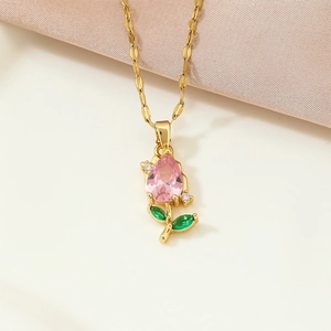 Elegant gold tulip necklace with pink pear-shaped stone and green leaves pendant