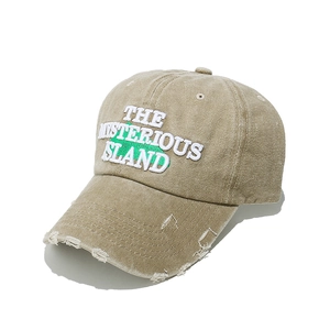 Detail of embroidered The Mysterious Island text and distressed brim on khaki cap