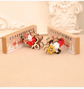 Macro detail of wooden Christmas countdown calendar with Santa and gnome sliders