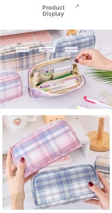 Internal view showing mesh pockets and multi-layer storage compartments of the pencil case