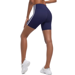 Detail view of navy blue high-waist biker shorts with white side stripes and lifting effect