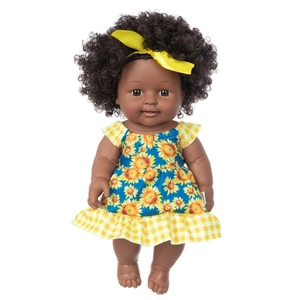 Detail of 12-inch African baby doll with curly hair wearing a sunflower pattern dress