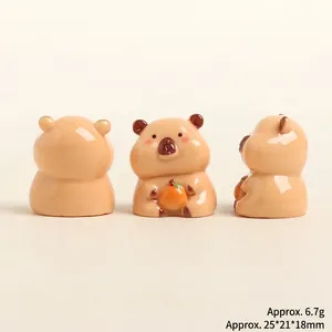 Three perspectives of resin Capybara miniatures showing size dimensions and 6.7g weight