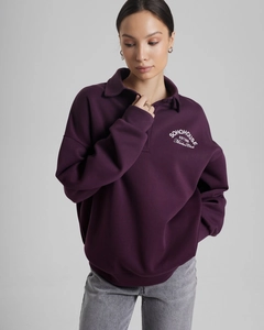 Detail of loose-fit purple sweatshirt with lapel collar and SOHOHOUSE letter printing