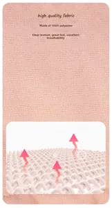 Detail of pink 100% polyester fabric showing honeycomb texture and breathable mesh layer