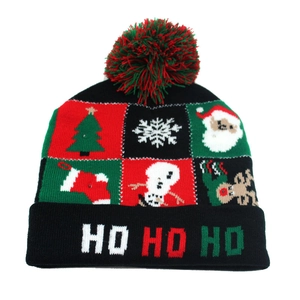 Close-up of knit Christmas beanie featuring festive patterns and LED light details