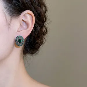 Vintage oval silver needle earrings with deep green crystal and pave zircon stones