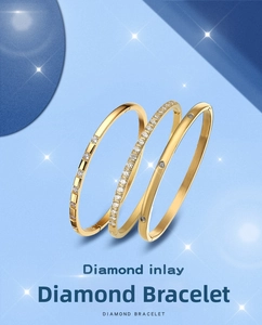 Detailed view of three gold titanium steel bangles with sparkling zircon diamond inlay