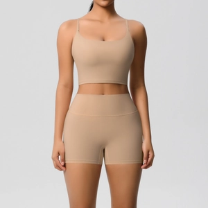 Detail of nude two-piece seamless yoga set with U-neck bra and high waist shorts