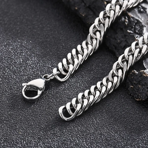 Detail of silver titanium steel curb chain necklace with a secure lobster clasp closure