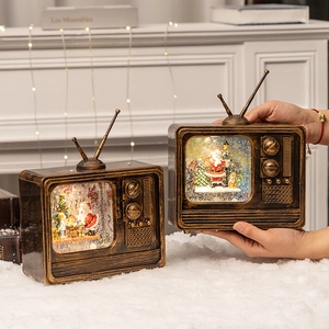 Retro TV Christmas snow globe music box with Santa and warm LED lights in bronze finish